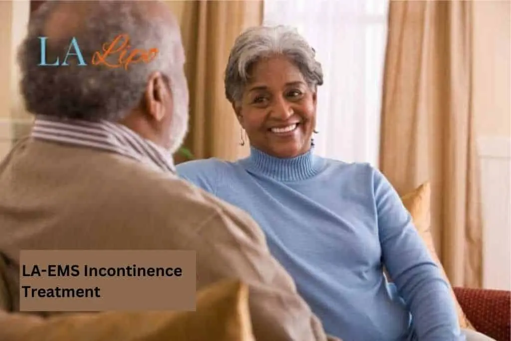 Couple sat smiling at each other - LA-EMS treatment ENGLAND