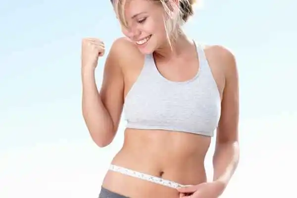 woman happy after fat reduction treatment ENGLAND