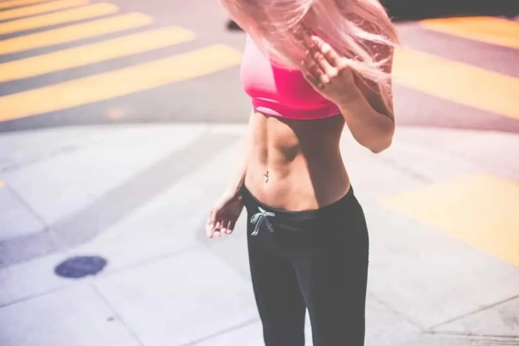 Woman with toned stomach after LA-EMS Body Sculpting Treatment ENGLAND